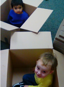 Boys Sitting Inside the Boxes
